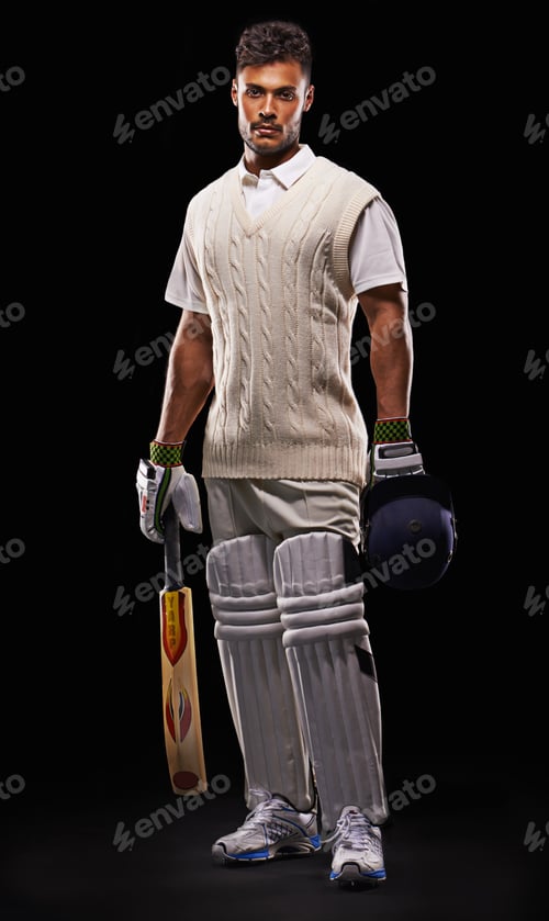 Preview: A cropped shot of an ethnic young man in cricket attire isolated on black