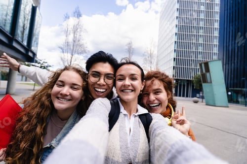 Preview: Student friends taking selfie portrait picture with cell smartphone outdoors in the modern city