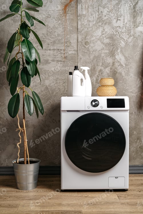 Preview: Washing machine in a gray modern laundry room