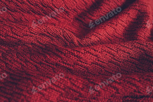 Preview: Beautiful knitted texture of red sweater. Close up background