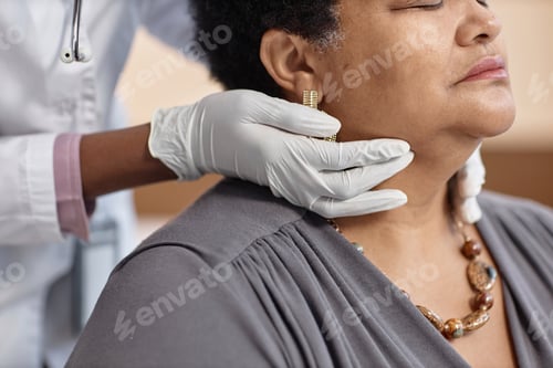 Preview: Hands of Physician Palpating Patients Neck