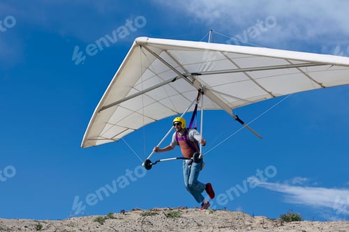 Preview: Hang glider pilot taking off
