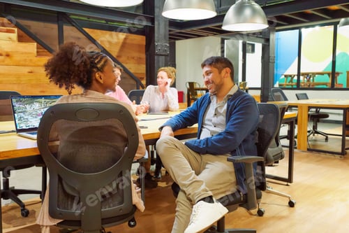 Preview: group of businessman colleagues in coworking offices working and chatting