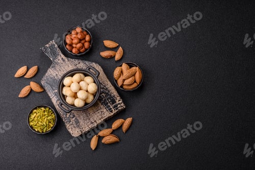 Preview: Raw peeled macadamia nut in ceramic bowl