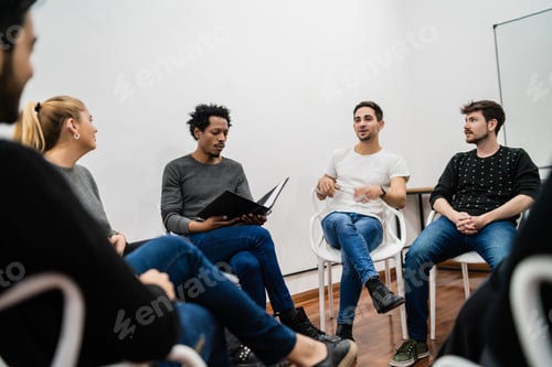 Preview: Multiethnic creative people having a brainstorming meeting.