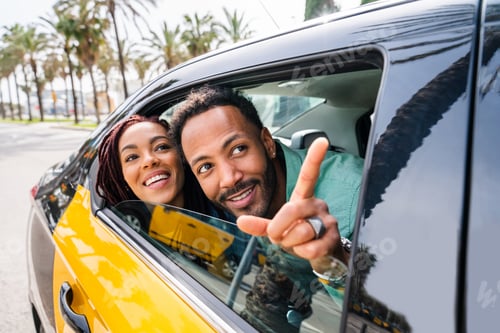 Preview: Happy hispanic latino couple taking a taxi