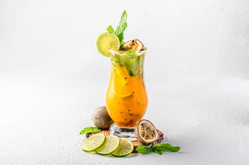 Preview: Closeup of a Passion fruit mojito on a white background
