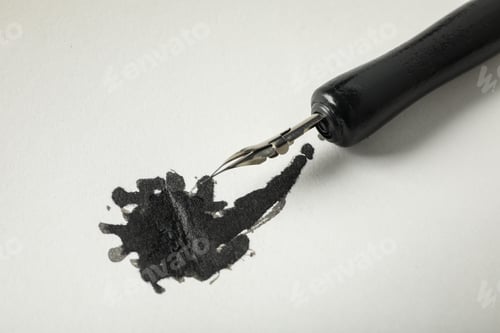 Preview: Ink blot and pen on white background, close up