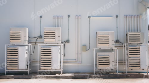 Preview: Air conditioner compressor installed on the wall of a building.