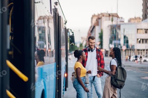 Preview: Multiracial group of people waiting for a public transport on a bus station