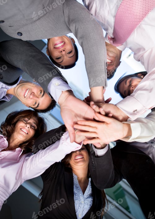 Preview: Group Of Business People With Hands Together - Teamwork Concepts