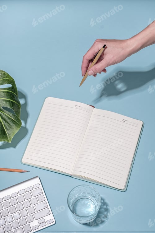 Preview: Office workstation on blue with keyboard and open notebook