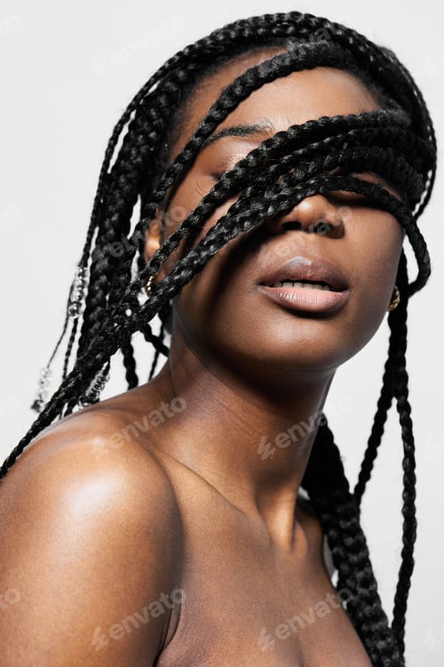 Preview: A beautiful young Black woman with braided hair, elegantly showcasing her natural beauty and