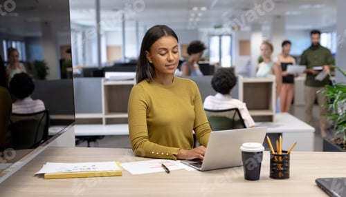 Preview: Young african american businesswoman using laptop while working at modern office