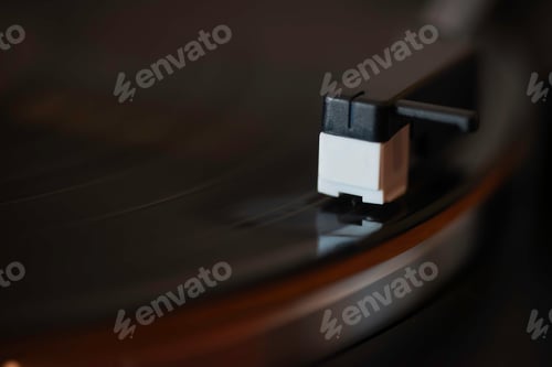 Preview: a close up of a dj turn table playing vinyl record