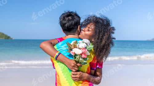 Preview: Romantic happiness couple LGBTQ lover just kiss big hug giving flower show happiness with equality f