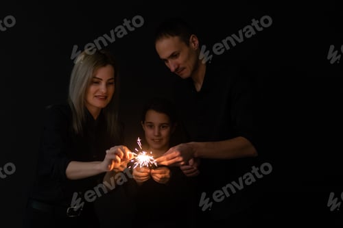 Preview: family with sparklers on a black background