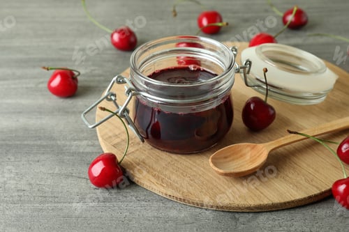 Preview: Cherry jam and ingredients on gray textured table