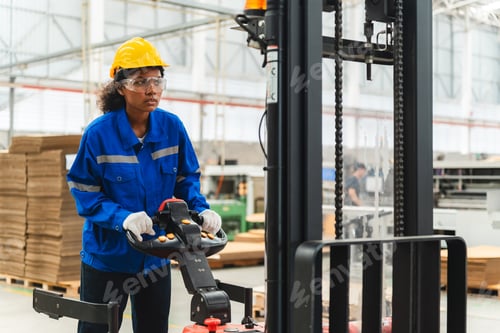Preview: paper cardboard manufacture factory concept, industry worker person working with recycling machine