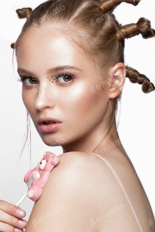 Preview: Portrait of beautiful cute girl with fun hairstyle and creative art make-up. Beauty face.