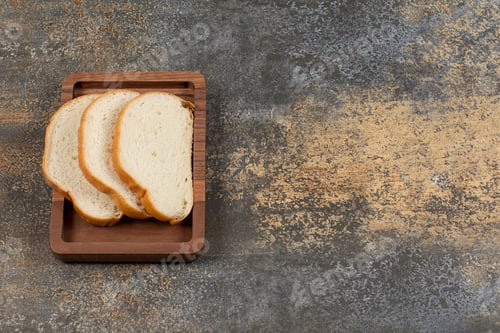 Preview: Tasty white bread slices on wooden plate
