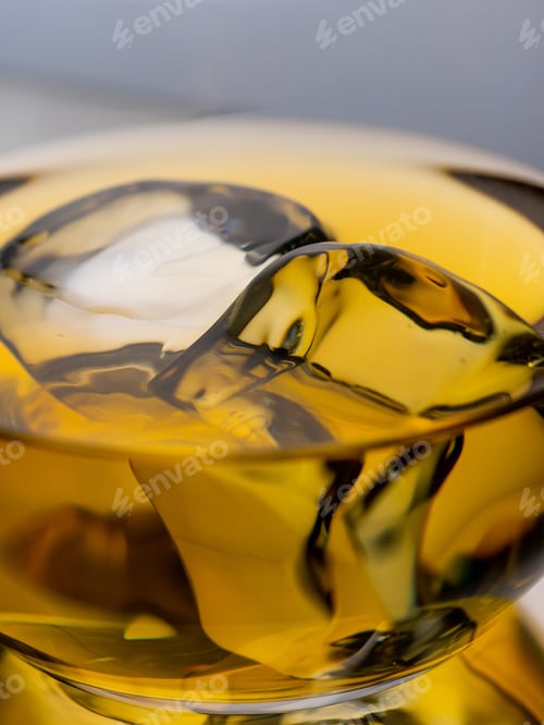 Preview: Glass of whisky with ice cubes, close-up shot