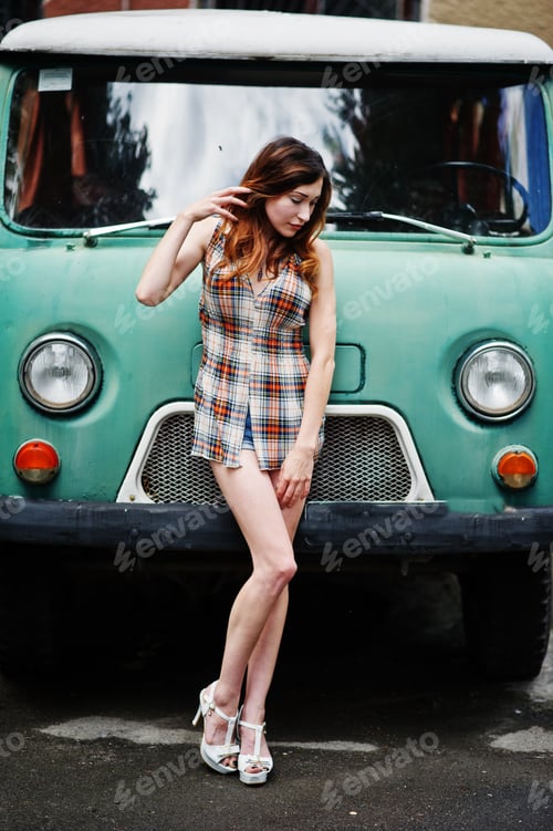 Preview: Amazing long legs with hig heels girl against old retro minivan.
