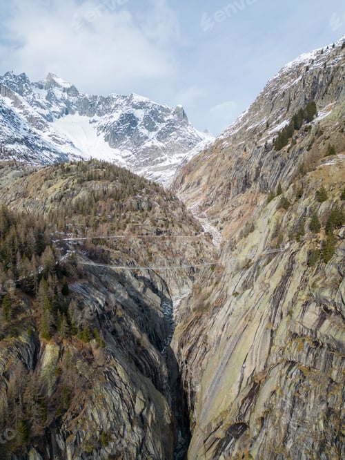 Preview: Aerial view of a picturesque winter landscape, featuring snow-covered mountain peaks and valleys