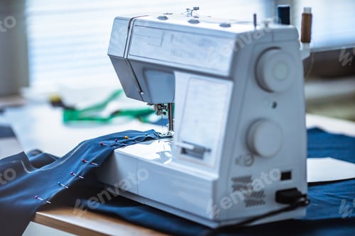 Preview: The sewing machine in the process of working with a cloth