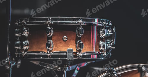 Preview: Close-up of a snare drum, part of a drum kit.