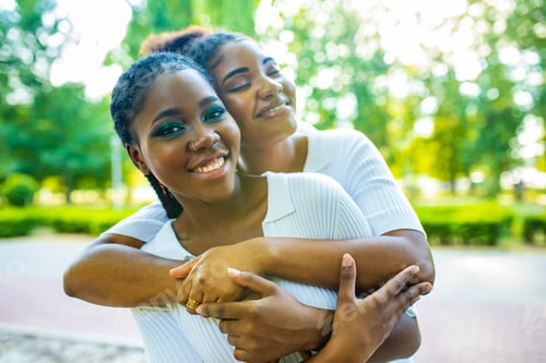 Preview: happy african american one gender couple in love dating outdoors in summer park