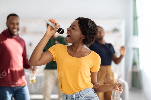 Preview: Closeup of pretty african american woman singing karaoke
