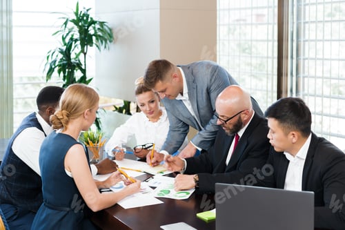 Preview: Group of professionals collaborating on a project in a modern office setting