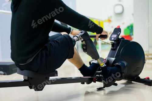 Preview: Male patient with physical disability doing exercise routine indoor