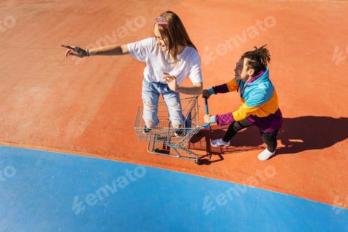 Preview: Multiracial group of young friends bonding outdoors
