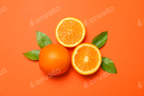 Preview: Ripe oranges and leaves on color background. Space for text