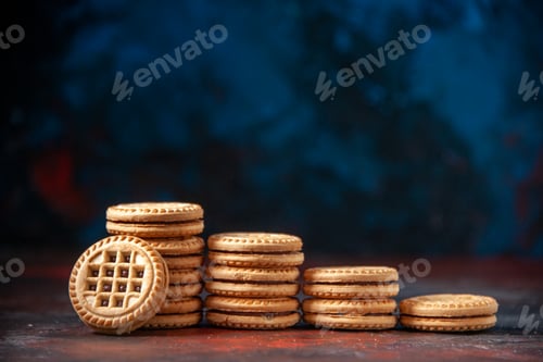 Preview: Horizontal view of delicious cookies stacked in different numbers on mix colors background