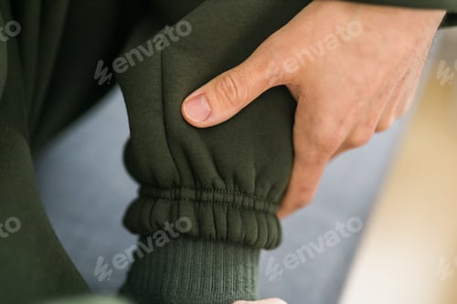 Preview: Close-up of cotton sports trousers fabric texture clothes - design clothes tailoring and youth