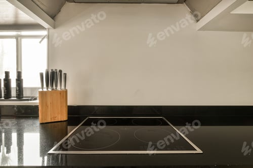 Preview: a kitchen with a stove and a block of knives