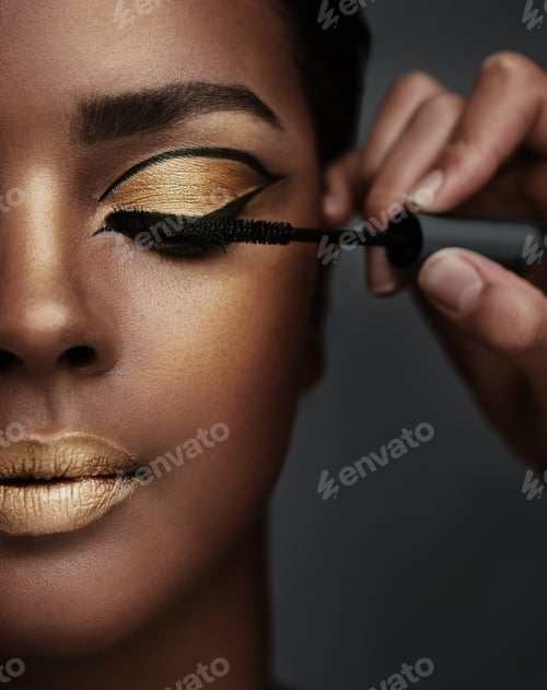 Preview: Shes about to have a fabuLash day. Cropped shot of a beautiful young woman having her makeup done.