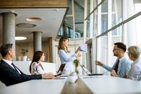 Preview: Business Meeting with Presentation in Modern Office