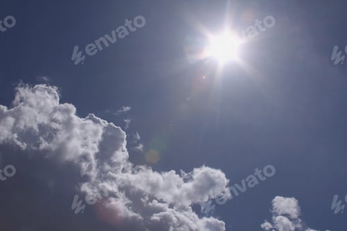 Preview: Bright Sun And Cumulus Clouds - Photograph Of A Bright Afternoon Sun And Cumulus Clouds That Are