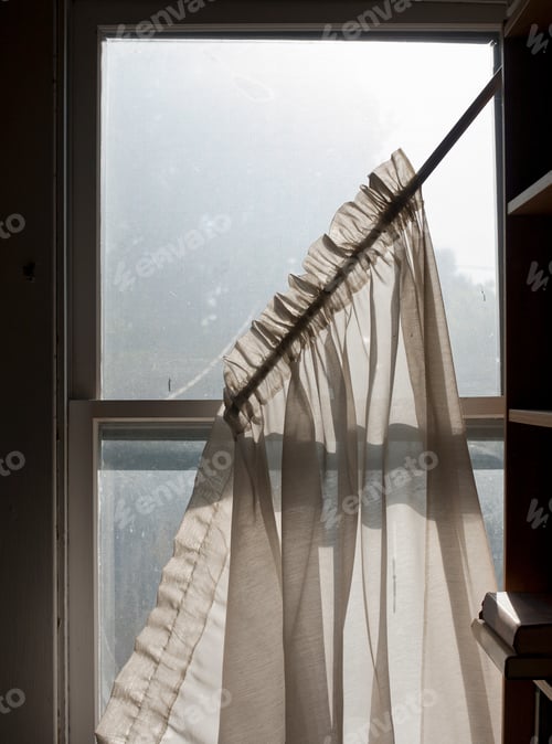 Preview: Net curtains falling from dirty sash window