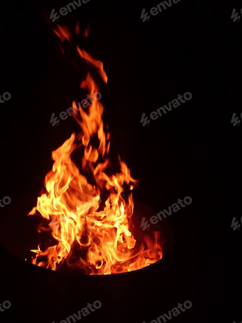 Preview: Bonfire sparkling in the black night, beautiful warm high orange and yellow flames, the heat is on!