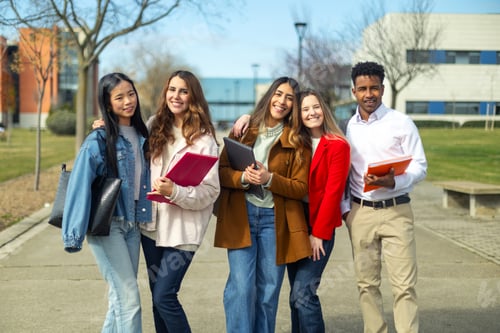 Preview: Happy university students posing together on campus
