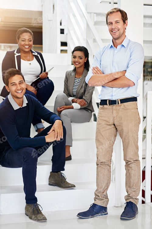 Preview: Portrait of a group of coworkers in a stairwell in a modern office