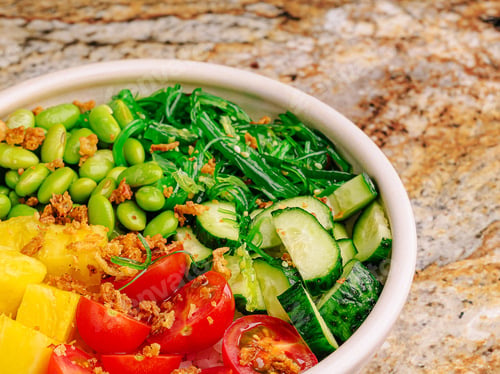 Preview: Colorful salad bowl with fresh vegetables and fruits on marble table