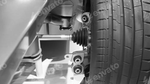 Preview: A vehicle's suspension system and tire.Black and white picture