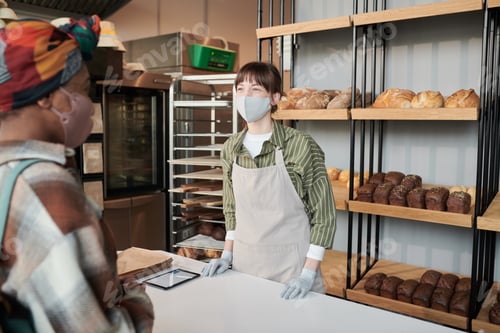 Preview: Woman selling bread to customer