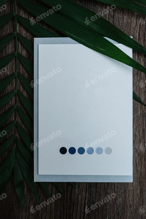Preview: wedding invitation in a gray envelope on a table